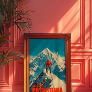 A striking poster featuring a climber in bright orange gear standing on a snowy mountain peak in Patagonia. This adventurous design captures the spirit of exploration and the beauty of the outdoors, perfect for nature lovers and thrill seekers.