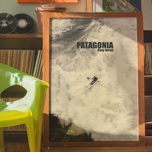 A thrilling poster featuring a paddler navigating intense whitewater rapids with the text Patagonia Stay Focus. This bold and adventurous design is perfect for extreme sports lovers and outdoor enthusiasts looking for dynamic wall decor.