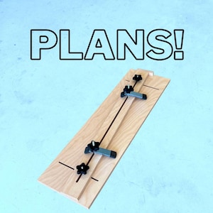 May include: A light-colored wooden woodworking jig with black adjustable knobs and clamps. The word "PLANS!" is written in large black letters above the jig. The jig has a central groove and is designed for precise cuts.