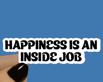 May include: White sticker with black text that reads "Happiness is an inside job". The sticker is available in 3, 4, or 5 inch lengths.