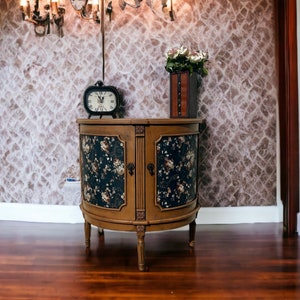 Versatile textured finish cabinet, Elegant black and rust colored entry table, Floral cabinet for storage, Medium sized storage cabinet