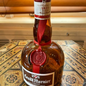 Grand marnier empty bottle, empty liqueur bottle.