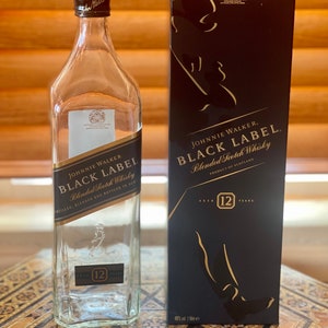 Black label empty bottle with box for craft and decor.