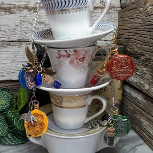 Magical Tea Strainer with Cup & Saucer | Wizard House Stainless Steel Loose Leaf Tea Infuser | Reusable Tea Bag | Witch Wizard School Tea