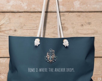 Large Weekender Tote Bag with an anchor design and a quote that says 'Home is where the anchor drops'