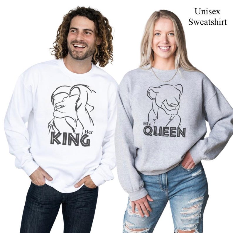 May include: Two unisex sweatshirts, one white and one gray. The white sweatshirt features a lion graphic with the text "Her KING". The gray sweatshirt has a lioness graphic with the text "His QUEEN". The text "Unisex Sweatshirt" is at the top right.
