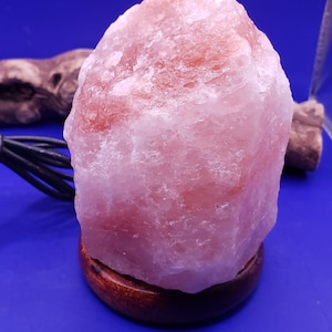 Bring serenity anywhere with this USB Himalayan Pink Salt Lamp, hand-carved from genuine Himalayan salt crystals. Compact and portable, it’s perfect for your desk, nightstand, or meditation space—just plug it into any USB port and enjoy its soothing glow.