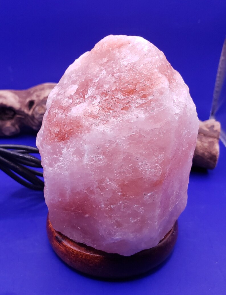 These lamps are made from large chunks of pink Himalayan salt, which is known for its soft, warm glow when lit. The soothing light emitted by these lamps creates a calming ambiance, perfect for relaxation and unwinding after a long day.