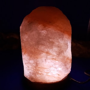 Bring serenity anywhere with this USB Himalayan Pink Salt Lamp, hand-carved from genuine Himalayan salt crystals. Compact and portable, it’s perfect for your desk, nightstand, or meditation space—just plug it into any USB port and enjoy its soothing glow.