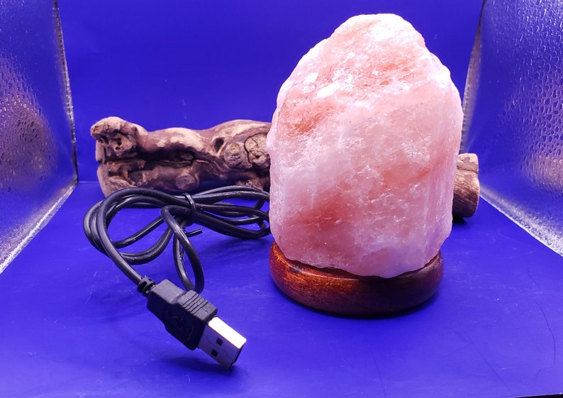 Bring serenity anywhere with this USB Himalayan Pink Salt Lamp, hand-carved from genuine Himalayan salt crystals. Compact and portable, it’s perfect for your desk, nightstand, or meditation space—just plug it into any USB port and enjoy its soothing glow.