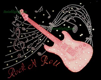May include: Pink electric guitar with rhinestones and musical notes, surrounded by stars. The words "Rock N Roll" are written in pink rhinestones below the guitar.