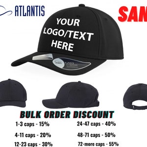 May include: Black baseball cap with a mid visor. The cap has a white text overlay that says "YOUR LOGO/TEXT HERE". The image also shows a bulk order discount chart with different price breaks for orders of 1-3 caps, 4-11 caps, 12-23 caps, 24-47 caps, 48-71 caps, and 72 or more caps.