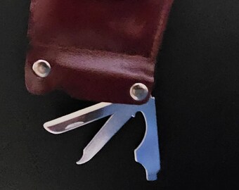 PBR Brake Group Coin Purse, Key Ring w/bottle opener, nail file and knife.