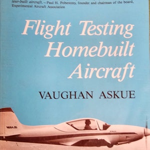 May include: A book titled "Flight Testing Homebuilt Aircraft" by Vaughan Askue. The cover features a light blue background with white text and a photo of a small, white airplane flying over a sandy landscape.