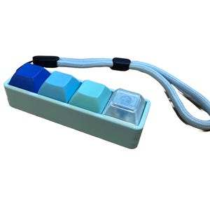 Office Friendly Silent Tactile Four-Button Keyboard Fidget Toy w/ Adjustable Wrist Strap, Multiple color options