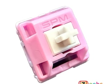 May include: A pink mechanical keyboard switch with a white stem and the text "SPM" printed on the top.