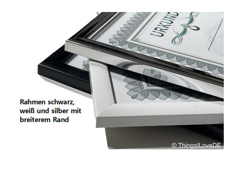 May include: Three picture frames stacked on top of each other. The top frame is silver, the middle frame is white, and the bottom frame is black. The frames have a wide border. The text "URKUND" is visible on the top frame.