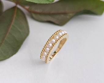 The pearl ring is an elegant and unique ring decorated with real pearls in 14K pure gold.