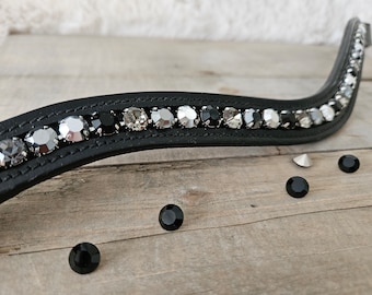 May include: Black leather horse browband with a row of silver and black rhinestones.