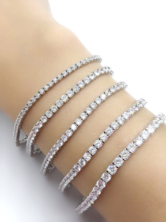 SWAROVSKI Tennis Deluxe bracelet, Round cut, White, Rose gold-tone plated -  JEWELLERY from Adams Jewellers Limited UK