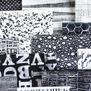 May include: An abstract collage of black and white patterned paper squares. The patterns include polka dots, stripes, text, and organic shapes. The arrangement creates a visually dynamic and textured composition.