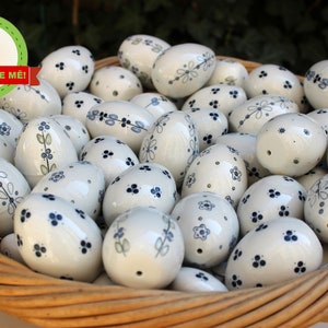 Handmade porcelain Easter eggs on a string - Spring decoration for Easter and folk customs - Flawed