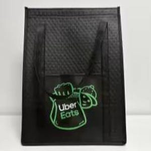 May include: Black insulated delivery bag with a green Uber Eats logo and a cartoon character on the front.