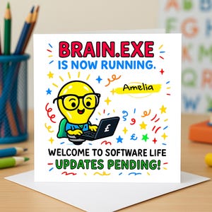 May include: A square greeting card featuring a cartoon lightbulb character with glasses and a cape, using a laptop. The card has the text "BRAIN.EXE IS NOW RUNNING" and "WELCOME TO SOFTWARE LIFE - UPDATES PENDING!" with the name "Amelia".