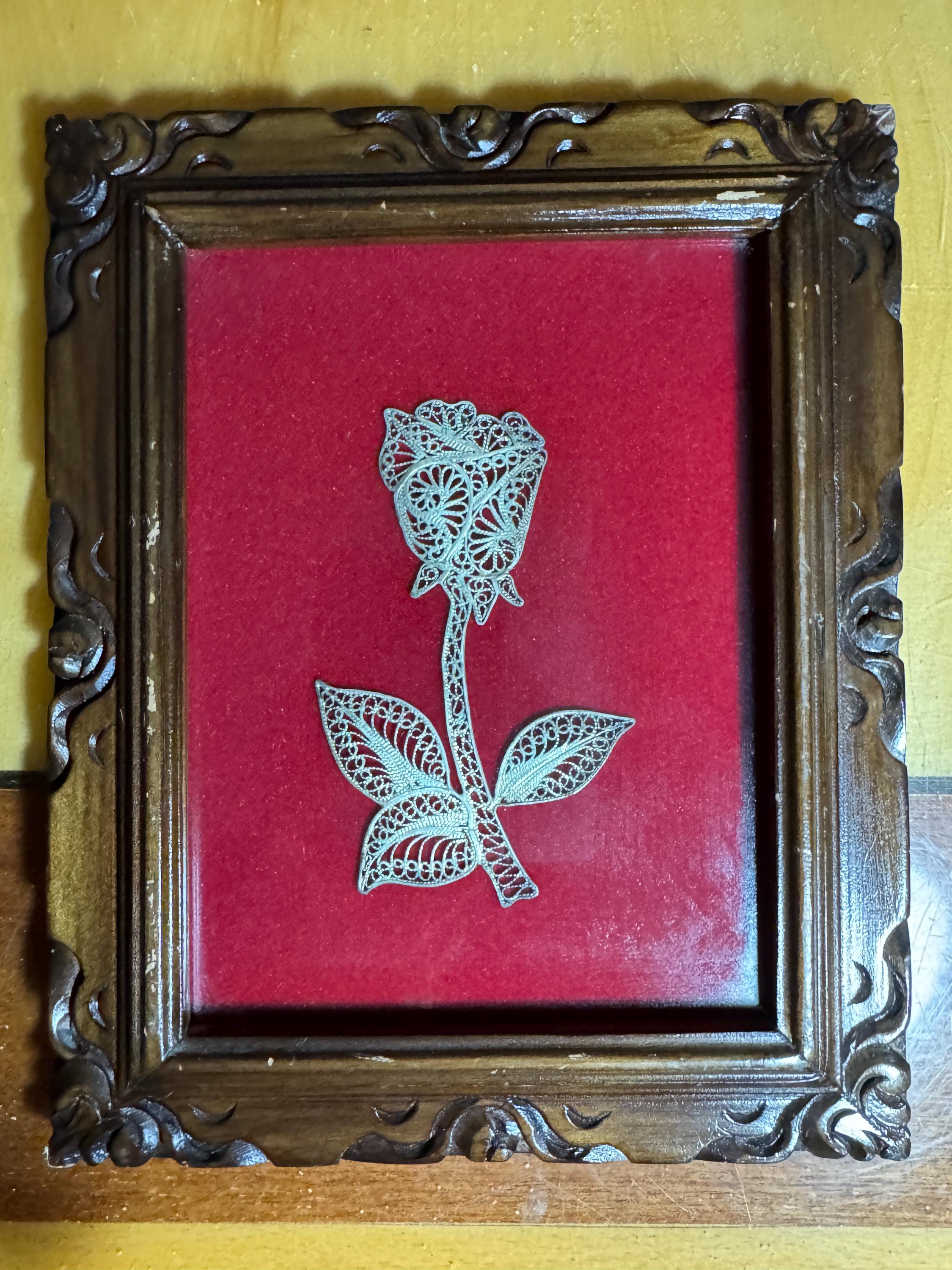 picture rosebud from silver wire in filigree technique