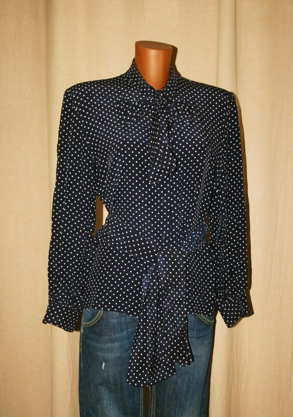 navy blue blouse with white polka dots
