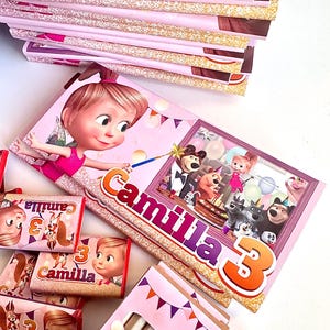 Festa Masha e Orso decorazioni compleanno bambina personalizzate con snack e gadget, tavoletta di cioccolato, lecca lecca regalo fine festa.