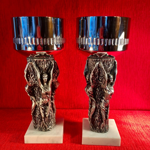 Pair of ceremonial chalices, chrome cups and marble bases with four angels