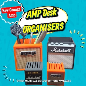May include: Desk organisers in the shape of guitar amplifiers, in orange and black. One orange organiser has the word "ORANGE", and another has "Marshall". The text "AMP Desk ORGANISERS" is also visible. The text "New Orange Amp" is in a white and red bubble.