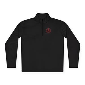 May include: Black long-sleeve quarter-zip pullover with a small red circular design on the upper left chest. The pullover has a mock neck and a zipper that extends down the chest.