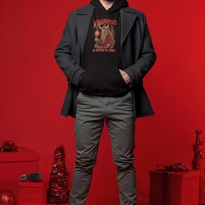 Krampus kommt in die Stadt Hoodie, Satan Santa Shirt, Urlaub Horror Krampus Hoodie, Weihnachtskrampus Geschenk Unisex Kapuzen-Sweatshirt