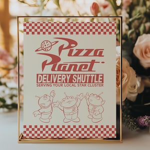 May include: A framed sign with the words "Pizza Planet" in red, featuring a planet graphic and the text "Delivery Shuttle". The sign has a red and white checkered border and depicts three cartoon aliens.