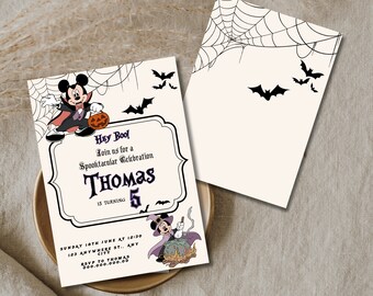 May include: A Halloween party invitation featuring a cartoon Mickey Mouse dressed as a vampire. The invitation is for Thomas's 5th birthday party. The text on the invitation reads "Hey Boo! Join us for a Spooktacular Celebration Thomas 5 is turning. Sunday 18th June at 18:30 123 Anywhere St., Any City RSVP to Thomas 000.000.000.00"