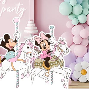 May include: A pink and white carousel with Mickey Mouse and Minnie Mouse riding white horses. The carousel is decorated with pink and blue ribbons. The background is a pink wall with a white sign that says "Let's Party".