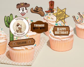 May include: Cupcakes with white icing and colourful sprinkles, decorated with Wild West themed toppers. Toppers include a Mickey Mouse cowboy, a sheriff's badge, a horseshoe, and signs that say "Thomas 1st Birthday", "Thomas Wild West", "Saloon", and "Happy Birthday".