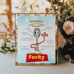 May include: A rectangular instructional sign with a light blue sky background featuring white clouds. The text reads Instructions How To Make Your Own Forky. It includes a central illustration of a spork character with googly eyes and red pipe cleaner arms, accompanied by step-by-step text instructions for assembly.