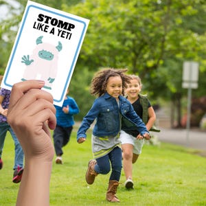 kids running with teacher holding card with stomp like a yeti.