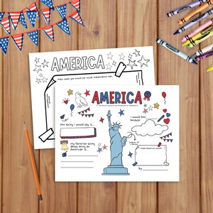 May include: Two coloring pages with the word "AMERICA" and patriotic illustrations, including the Statue of Liberty and stars. Crayons and a pencil are scattered around the pages, with American flag bunting in the background.