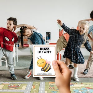 classroom circle time with hand holding buzz like a bee card.