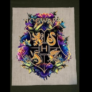May include: Embroidered patch featuring the Hogwarts crest, surrounded by colorful flowers and foliage. The crest includes a lion, snake, badger, and eagle, with the word "Hogwarts" at the top. The patch is on a neutral fabric background.