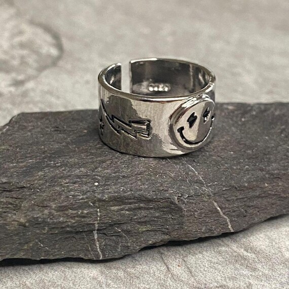 Smiley face lightning bolt ring deals