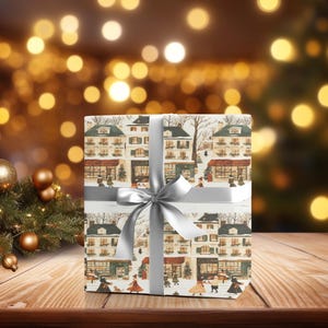 a present wrapped in a white ribbon on a wooden table