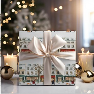 a gift wrapped in a white paper with a bow