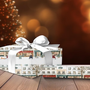 a present wrapped in white paper with a white bow