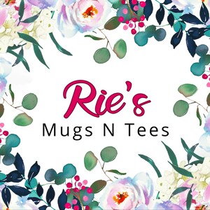 a floral border surrounding the text "Rie's Mugs N Tees" in a vibrant and colorful design.