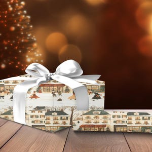 a present box with a white bow on a wooden table